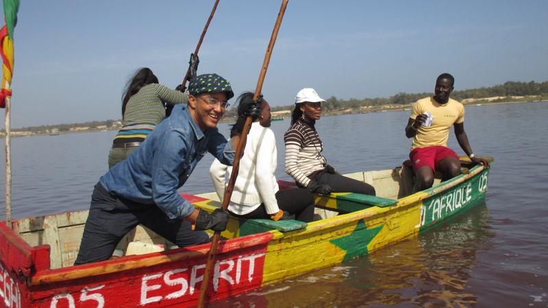 A group of people in an senegal boat