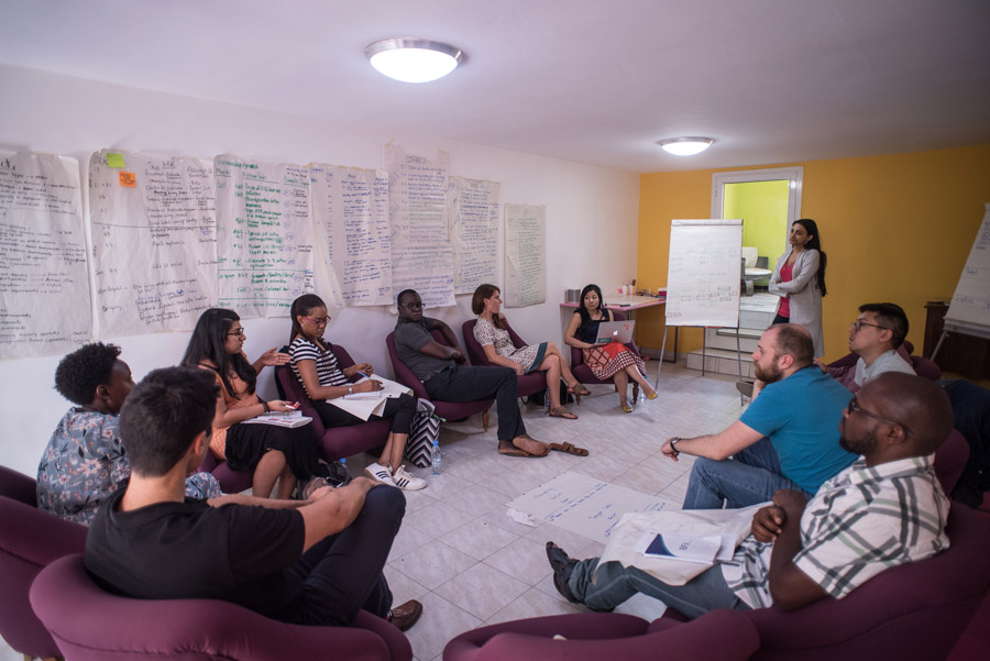 A group of people sitting in chairs in a room